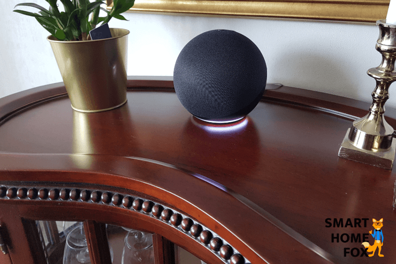 Amazon Alexa Echo stands on the table and glows white